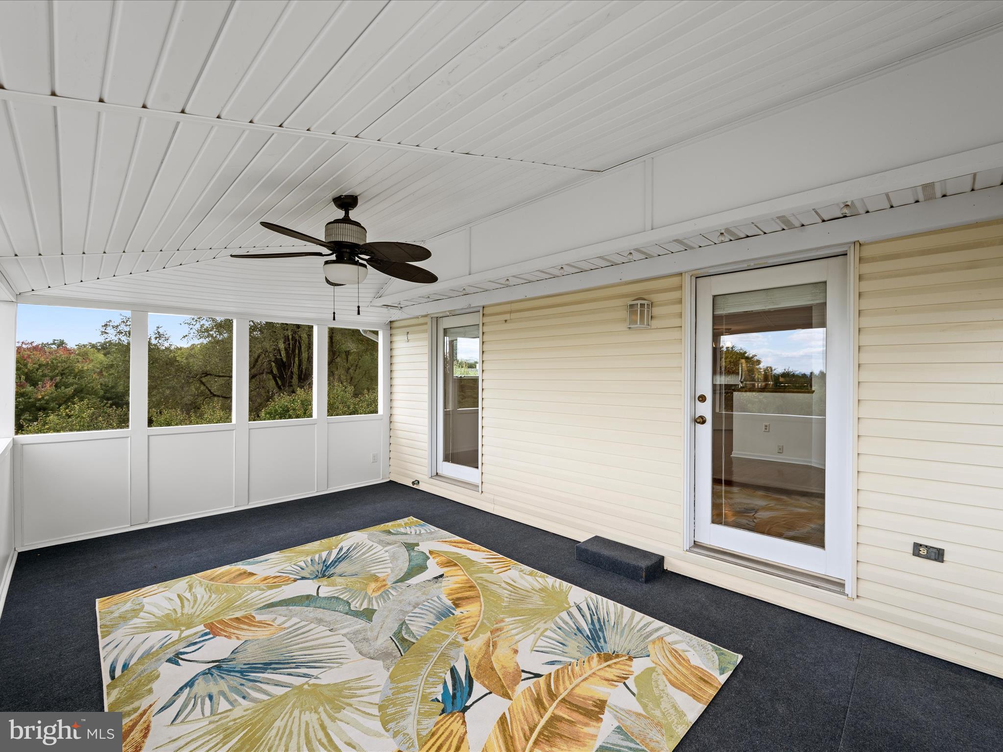 252 Punkin Ridge Drive Clear Brook, VA 22624 - Photo 61 of 80 a view of an empty room with a window and hardwood floor