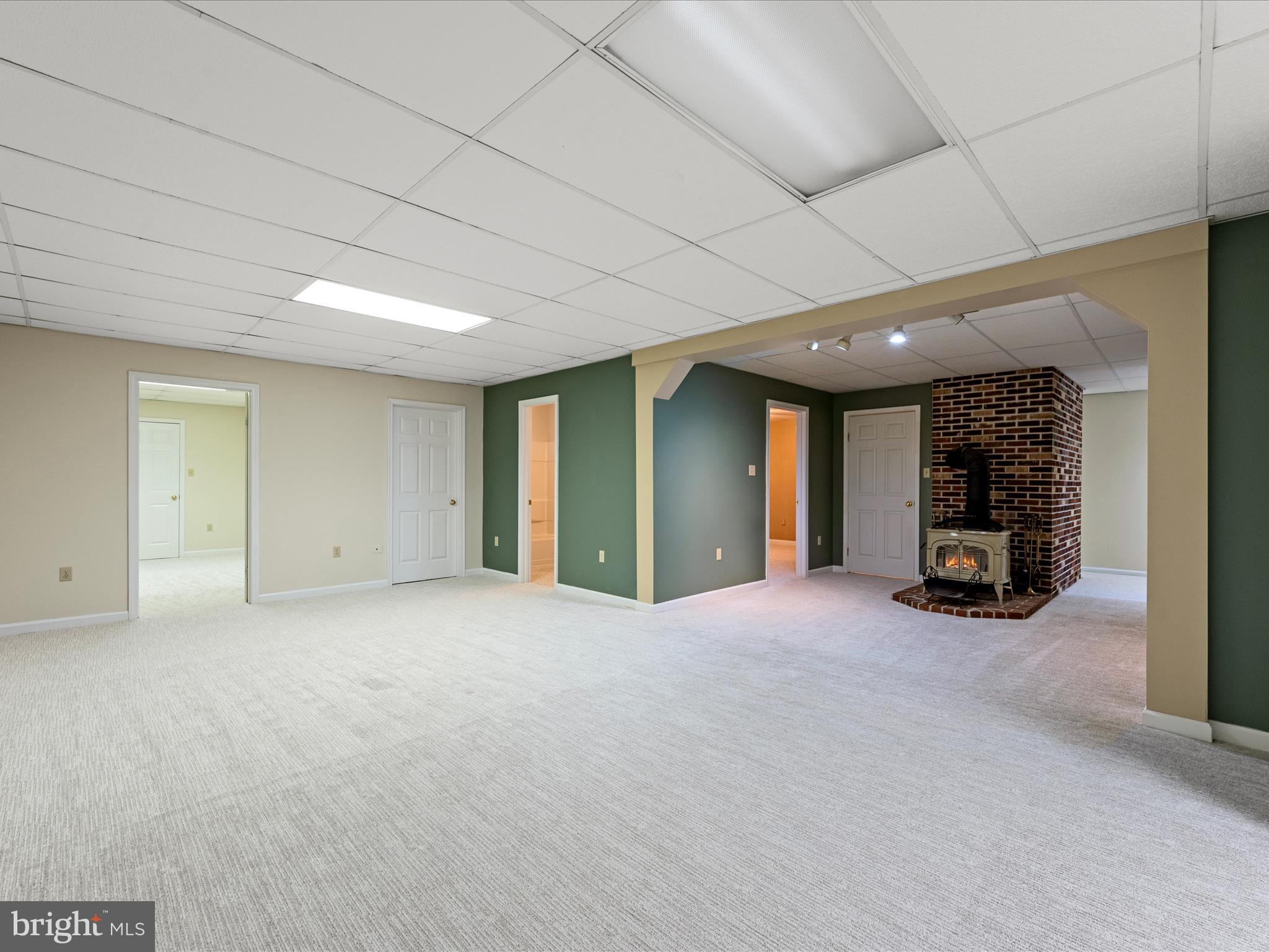 252 Punkin Ridge Drive Clear Brook, VA 22624 - Photo 68 of 80 a view of an empty room with window and a fireplace