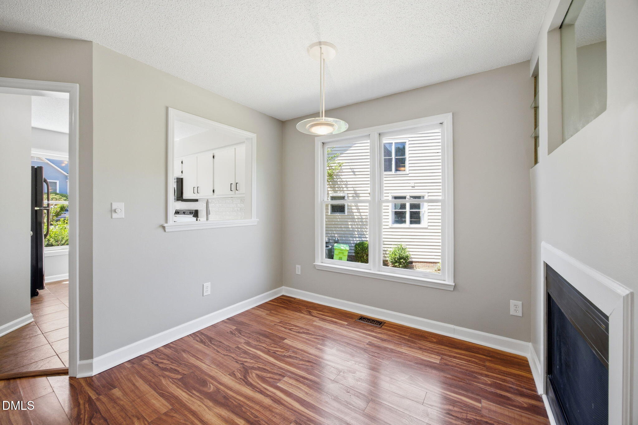 1626 Oakland Hills Way Raleigh, NC 27604 - Photo 11 of 25 a view of an empty room with window and wooden floor