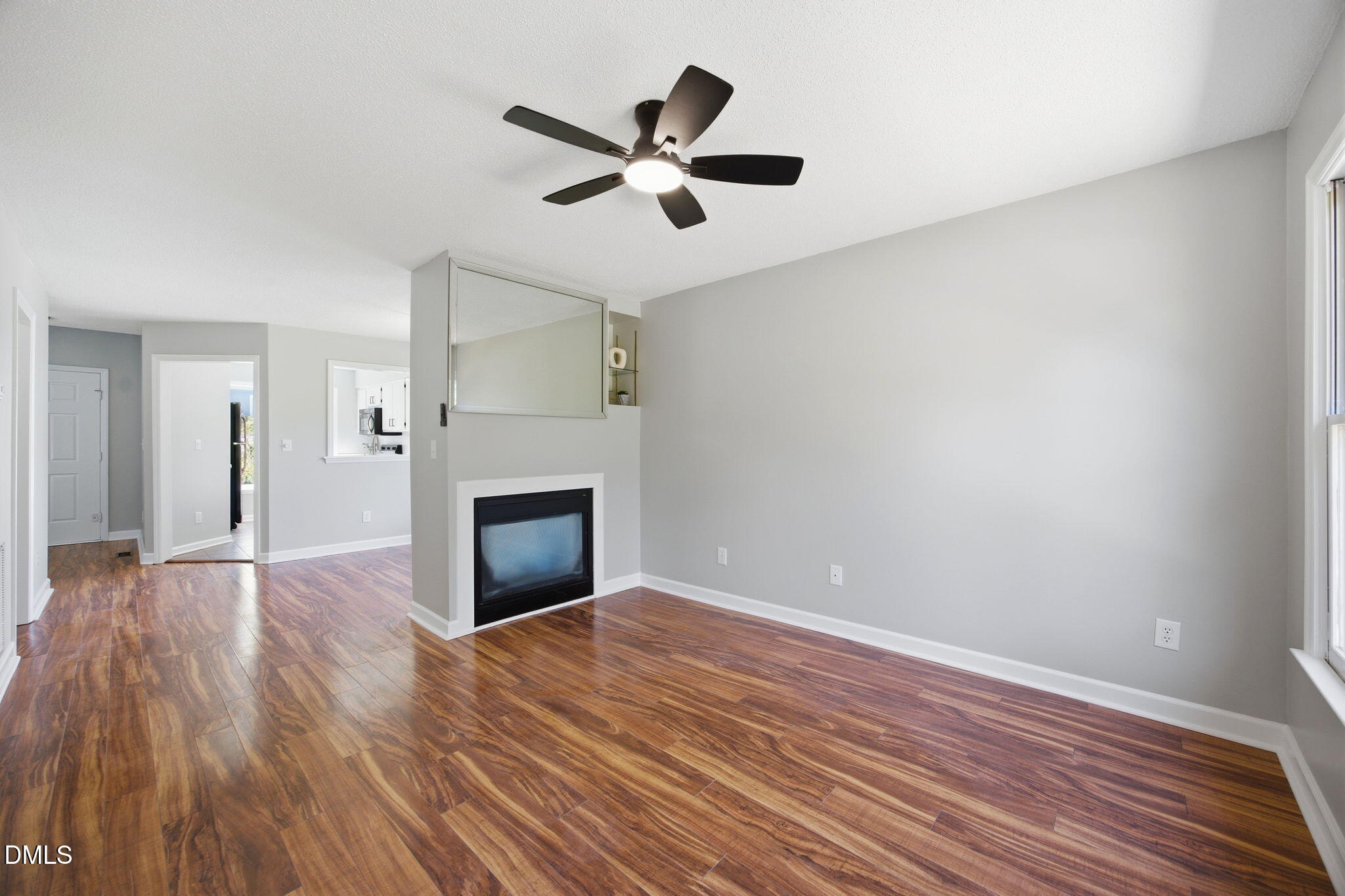 1626 Oakland Hills Way Raleigh, NC 27604 - Photo 13 of 25 a view of empty room with wooden floor and fireplace