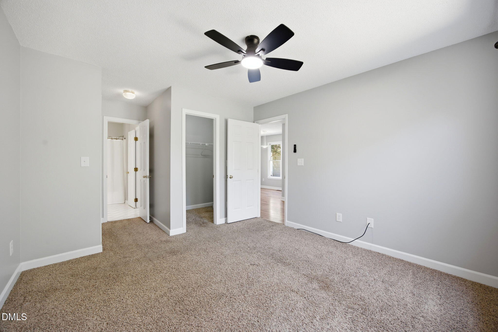 1626 Oakland Hills Way Raleigh, NC 27604 - Photo 15 of 25 a view of an empty room with a ceiling fan