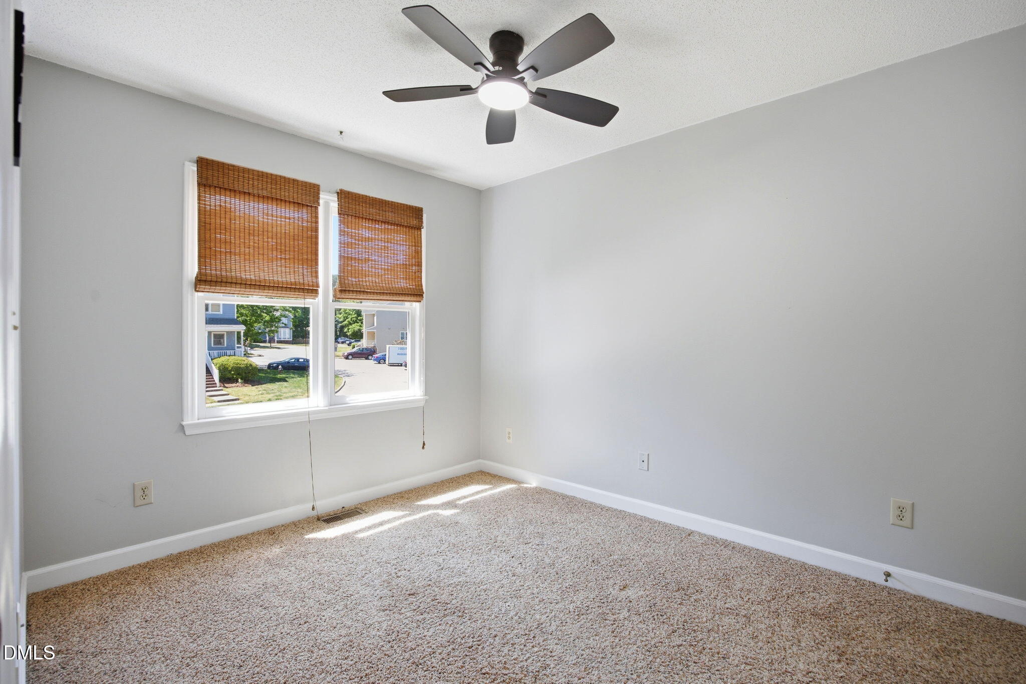 1626 Oakland Hills Way Raleigh, NC 27604 - Photo 17 of 25 an empty room with a window and a fan