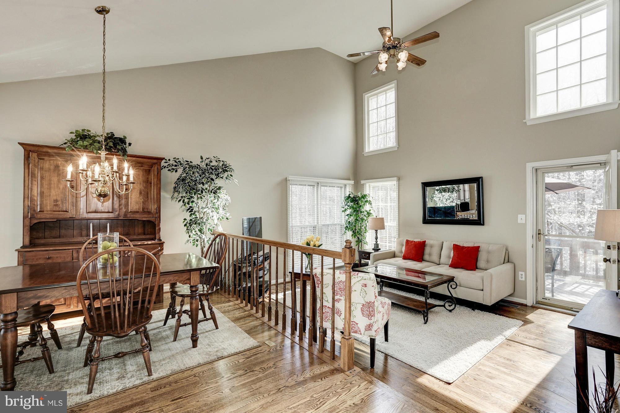 7415 Ridge Oak Court Springfield, VA 22153 - Photo 1 of 30 a living room with furniture a chandelier and a dining table