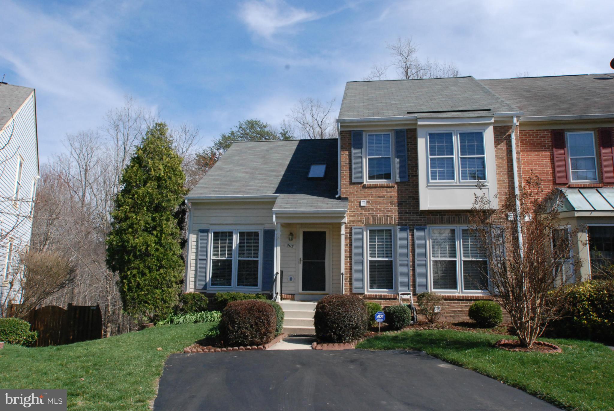 7415 Ridge Oak Court Springfield, VA 22153 - Photo 2 of 30 a front view of a house with garden and porch