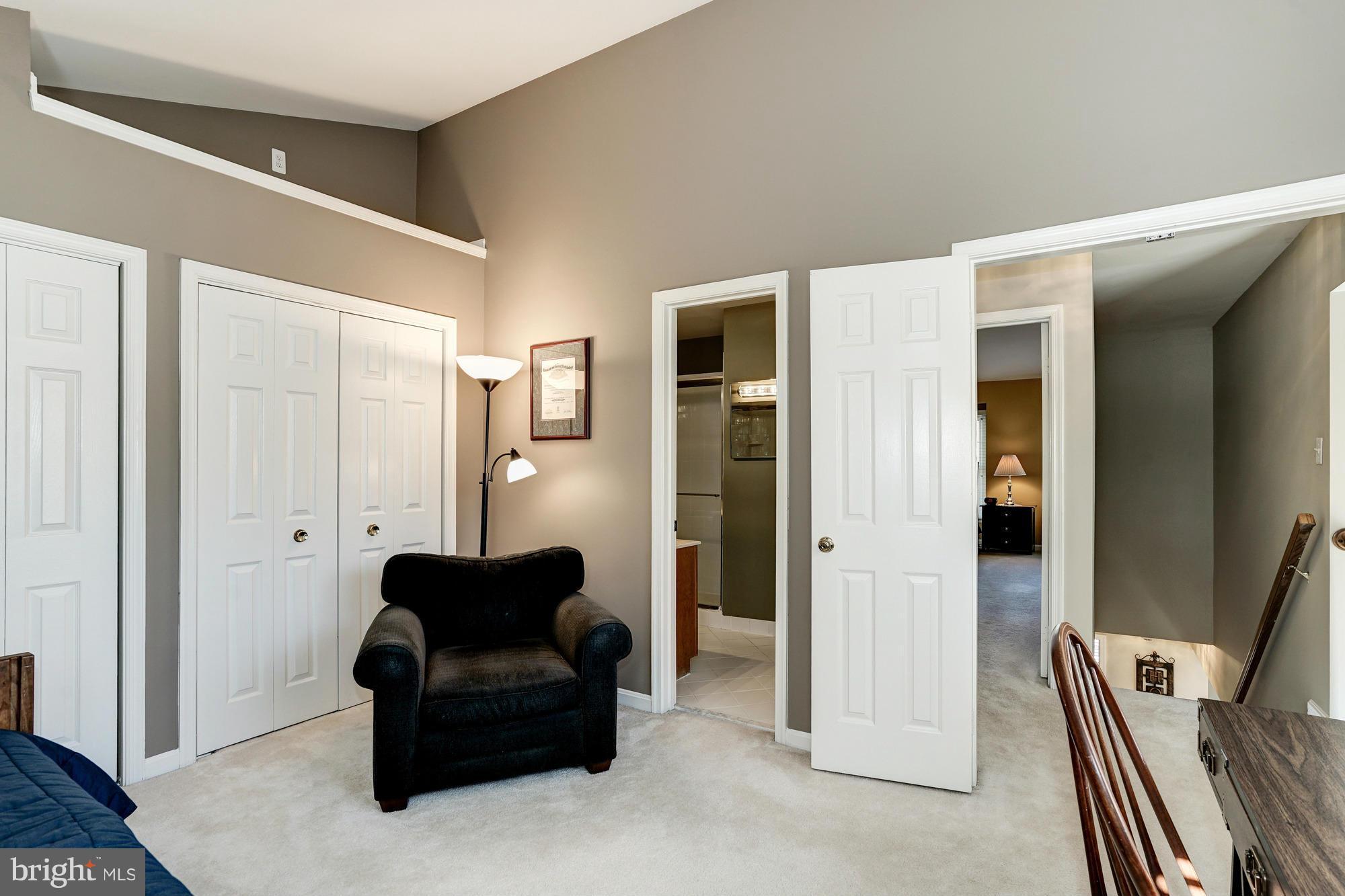 7415 Ridge Oak Court Springfield, VA 22153 - Photo 15 of 30 a living room with furniture and a hallway