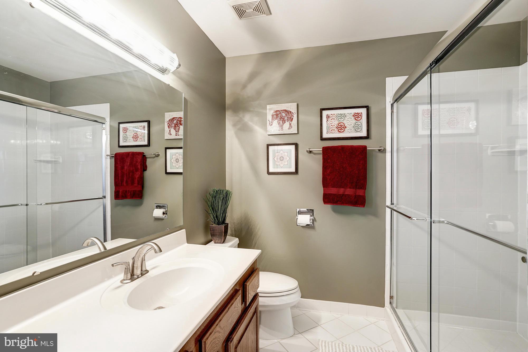 7415 Ridge Oak Court Springfield, VA 22153 - Photo 16 of 30 a bathroom with a sink toilet and shower
