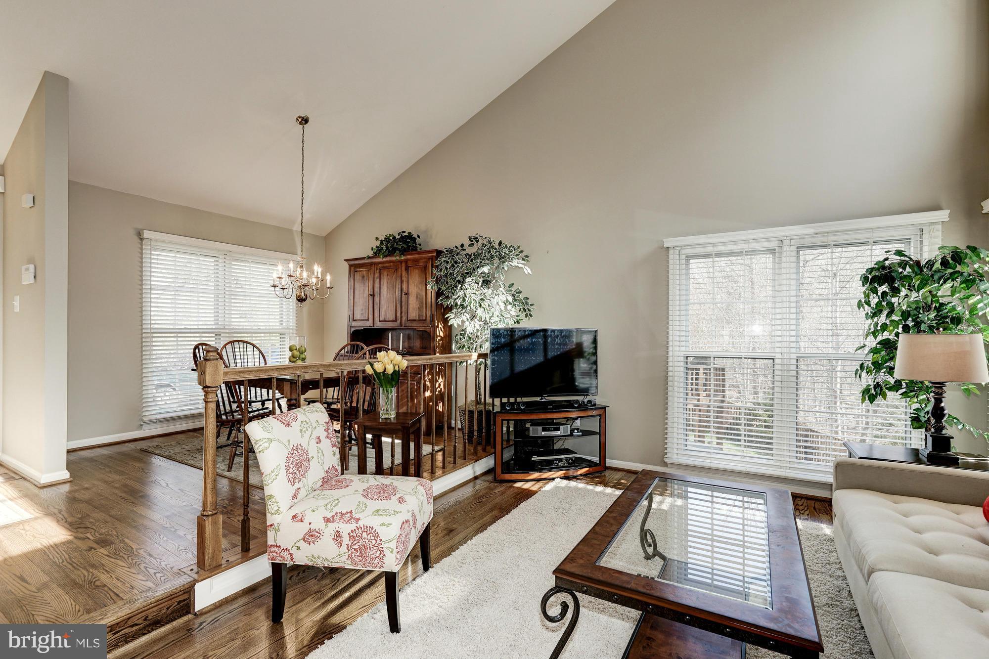 7415 Ridge Oak Court Springfield, VA 22153 - Photo 3 of 30 a living room with furniture a flat screen tv and a window
