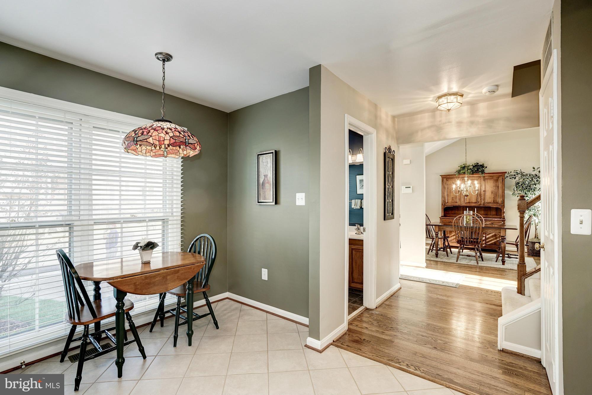 7415 Ridge Oak Court Springfield, VA 22153 - Photo 7 of 30 a view of a dining room with furniture and a chandelier