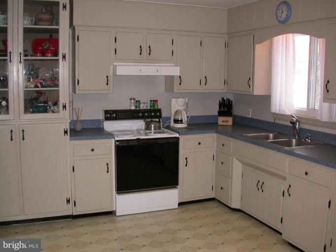 2520 Fairmount Road Hampstead, MD 21074 - Photo 6 of 12 a kitchen with cabinets appliances a sink and a window