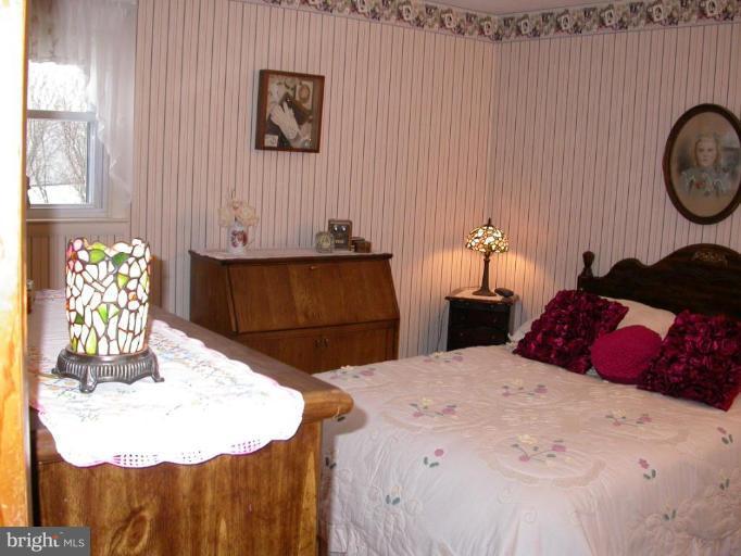 2520 Fairmount Road Hampstead, MD 21074 - Photo 9 of 12 a bedroom with a bed and a dresser