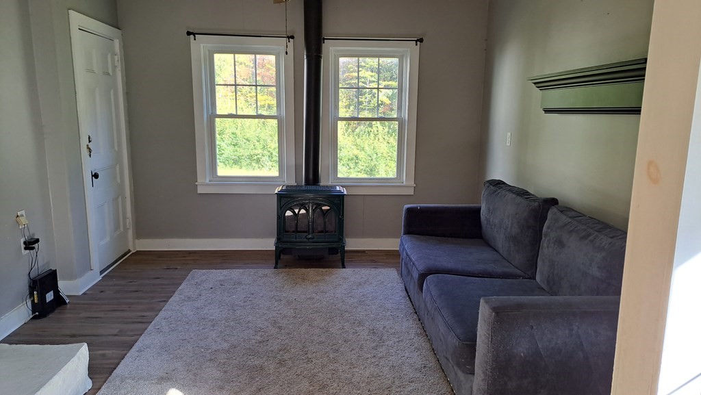 135 Thayer Road New Ipswich, NH 03071 - Photo 5 of 24 a living room with furniture and a window