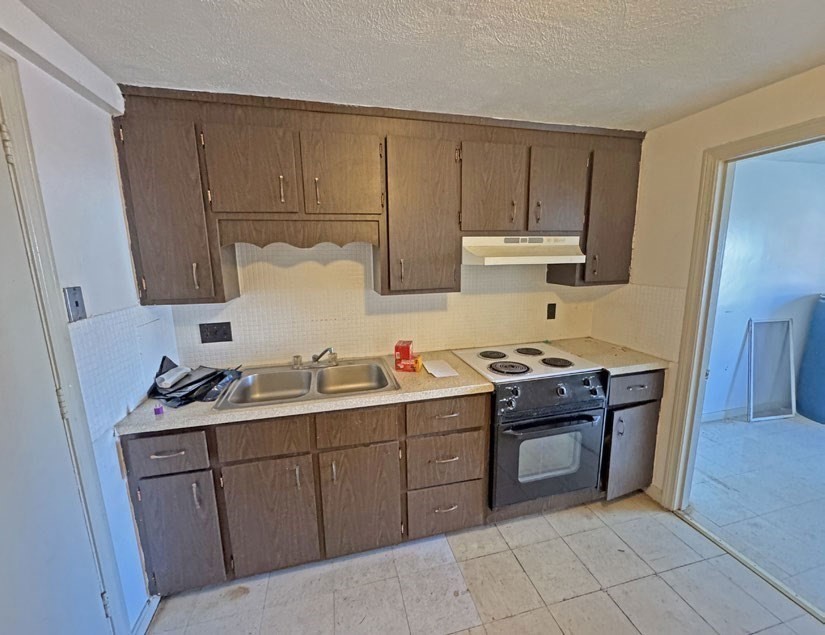 108 Franklin Street Lynn, MA 01902 - Photo 11 of 15 a kitchen with a sink and cabinets