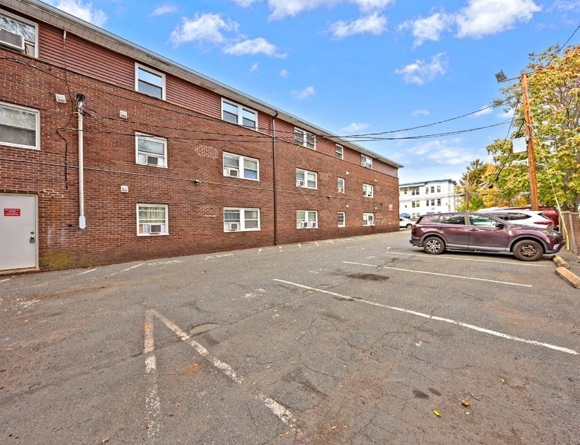 108 Franklin Street Lynn, MA 01902 - Photo 4 of 15 a front view of a building with parking