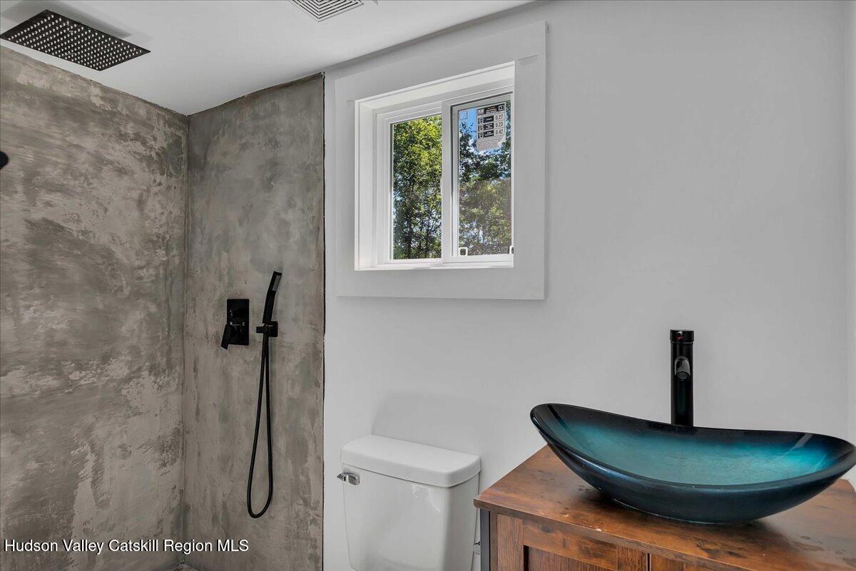 3603 County Rte 26 Greenville, NY 12083 - Photo 11 of 36 a bathroom with a sink and a mirror