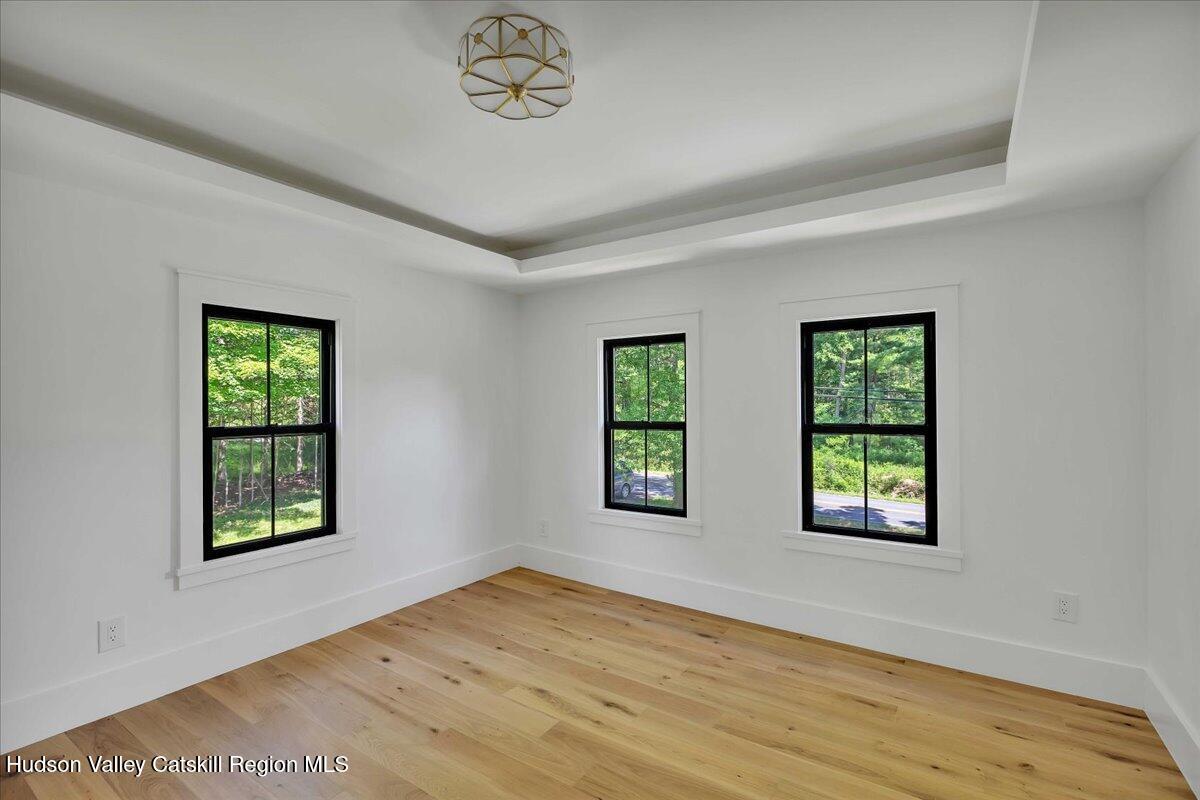 3603 County Rte 26 Greenville, NY 12083 - Photo 18 of 36 a view of an empty room with window and wooden floor