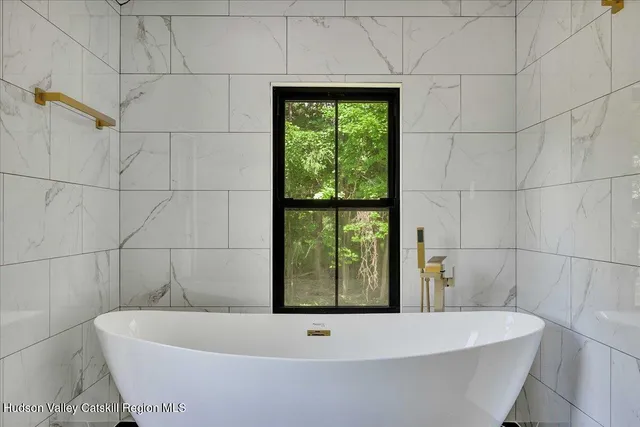a bathroom with a bathtub