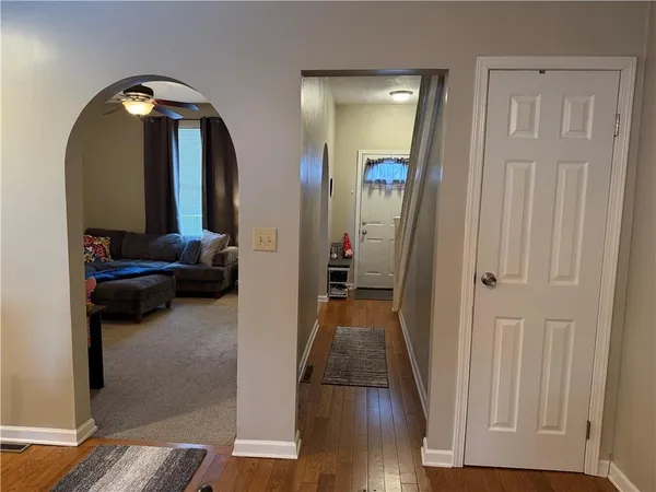 a view of a livingroom from a hallway
