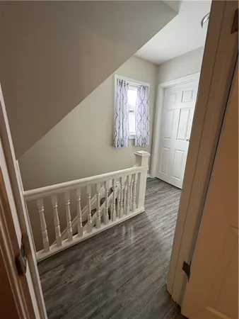 a view of entryway with wooden floor