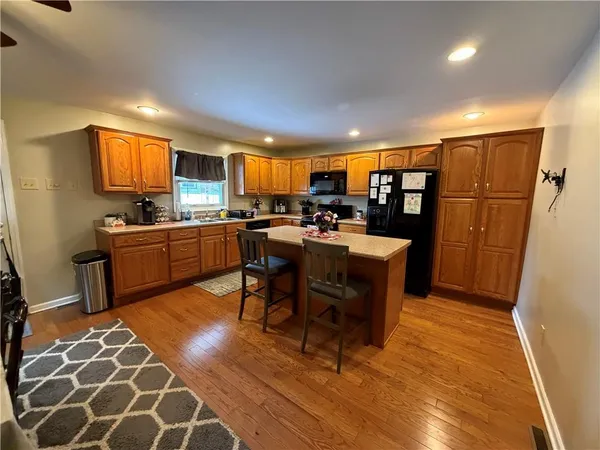 a view of a dining room with furniture and a rug