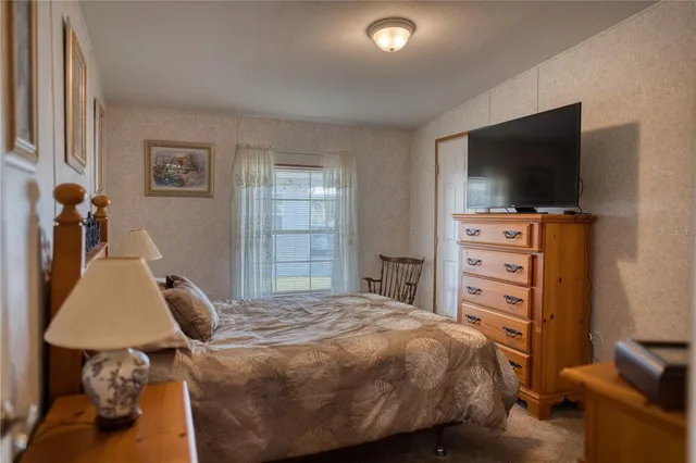 a bedroom with a bed and furniture