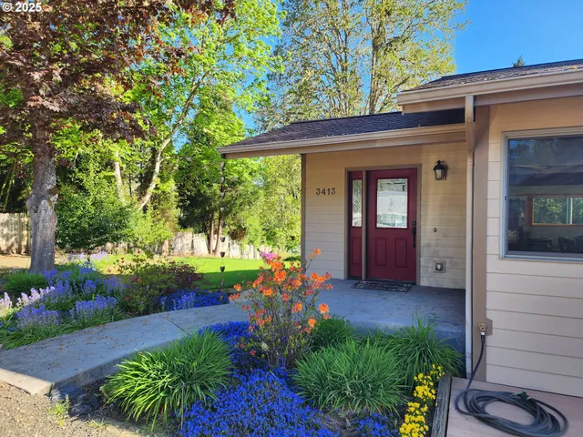 a view of a room with a ceiling fan and window