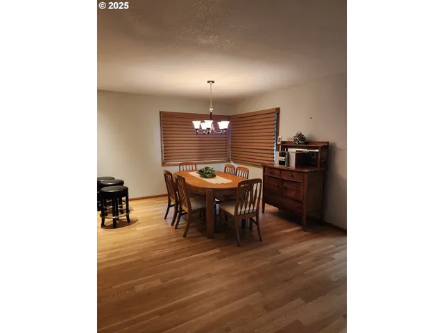 a view of a hallway to rooms