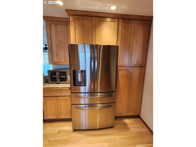 a bathroom with a double vanity sink and mirror
