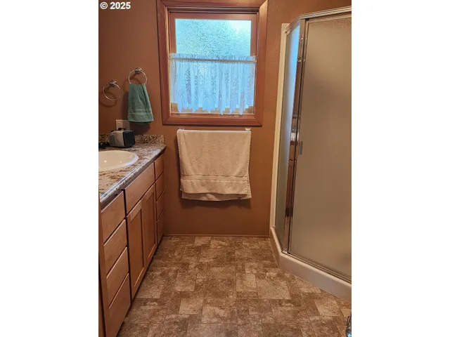 a bed room with a bed and a window