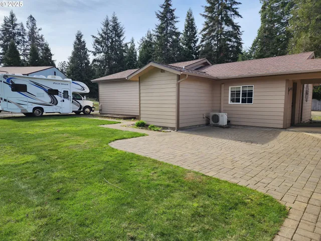 a view of a backyard of the house