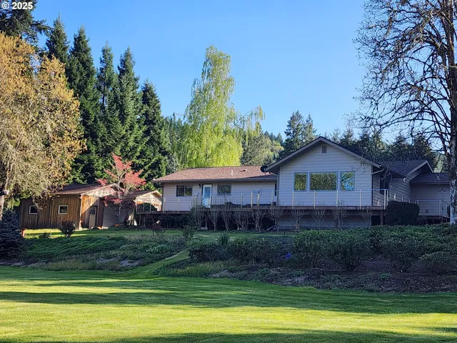 a view of a house with a flower garden