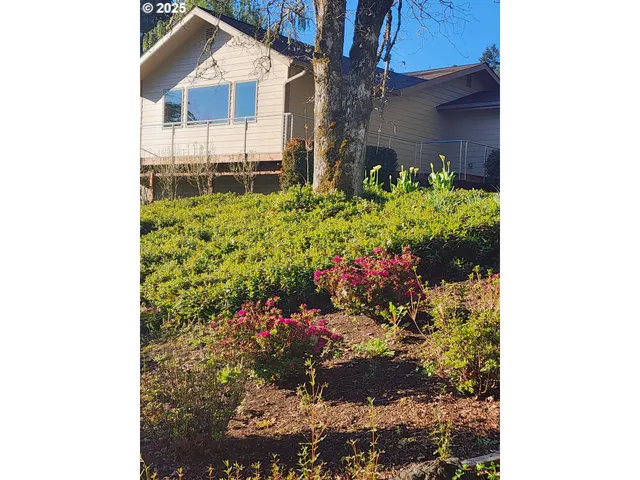 a spacious bathroom with a double vanity sink toilet and shower