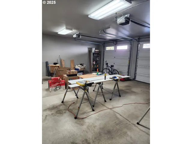 a view of a hall way with furniture