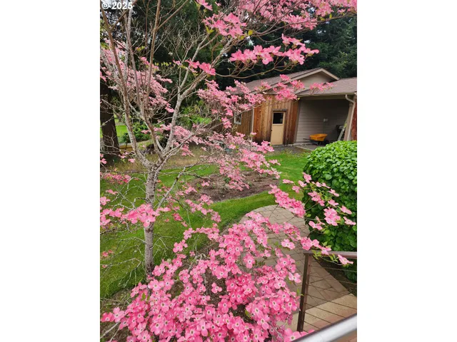 an aerial view of a residential apartment building with swimming pool