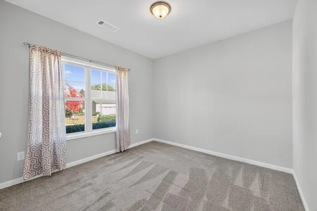 a view of an empty room and window