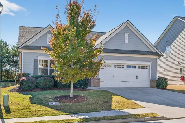 a front view of a house with garden