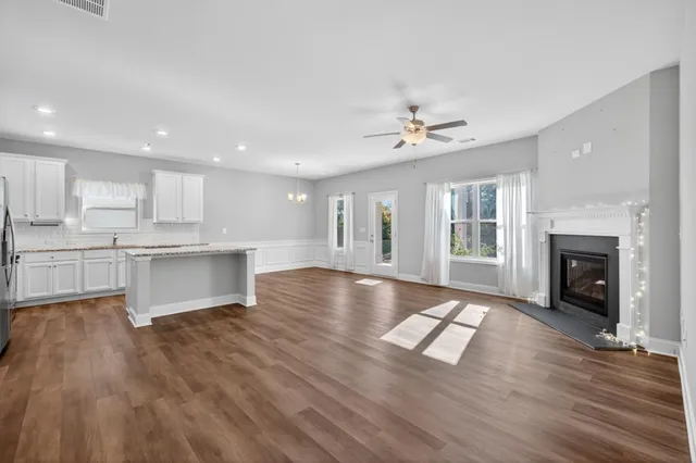 a view of kitchen with cabinets and wooden floor