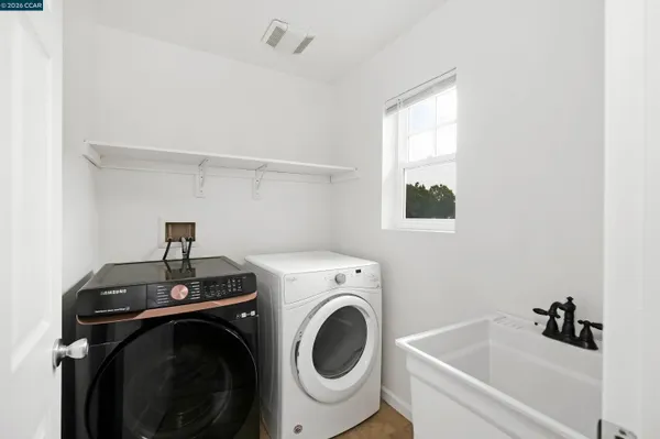 a utility room with dryer and washer