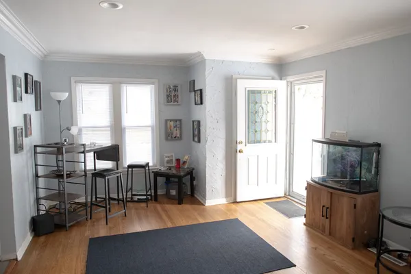 a livingroom with workspace and a window