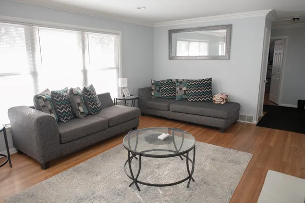 a living room with furniture and a window
