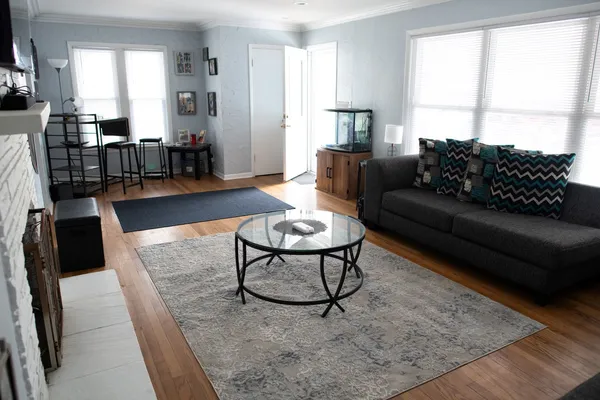 a living room with furniture and a large window