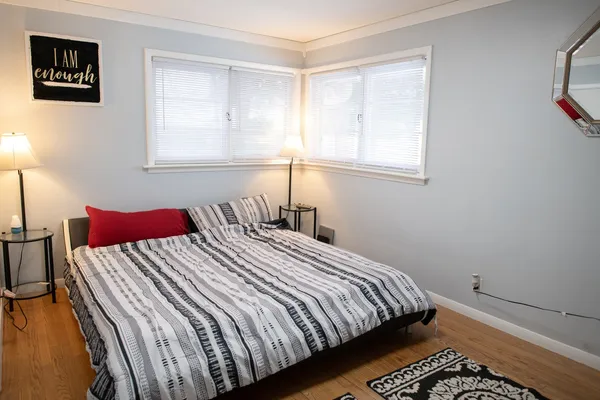 a view of room with furniture and wooden floor