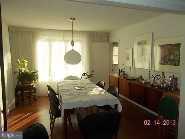 6218 Benhurst Road Baltimore, MD 21209 - Photo 3 of 13 a view of a a dining room with furniture window and wooden floor