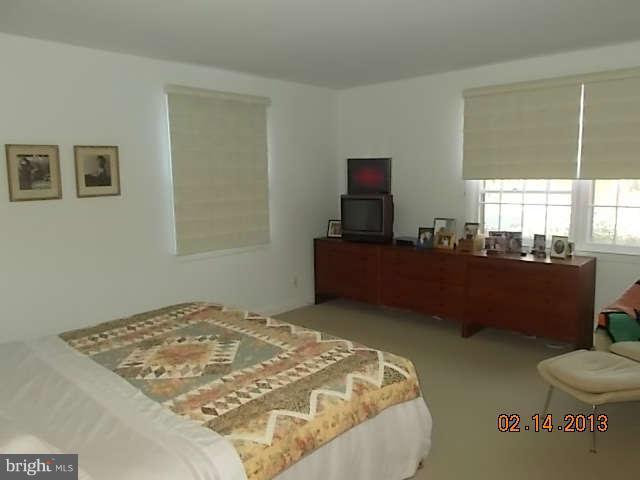 6218 Benhurst Road Baltimore, MD 21209 - Photo 5 of 13 a bedroom with a bed and window