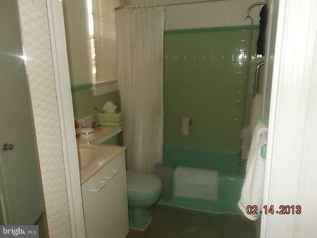 6218 Benhurst Road Baltimore, MD 21209 - Photo 6 of 13 a bathroom with a shower