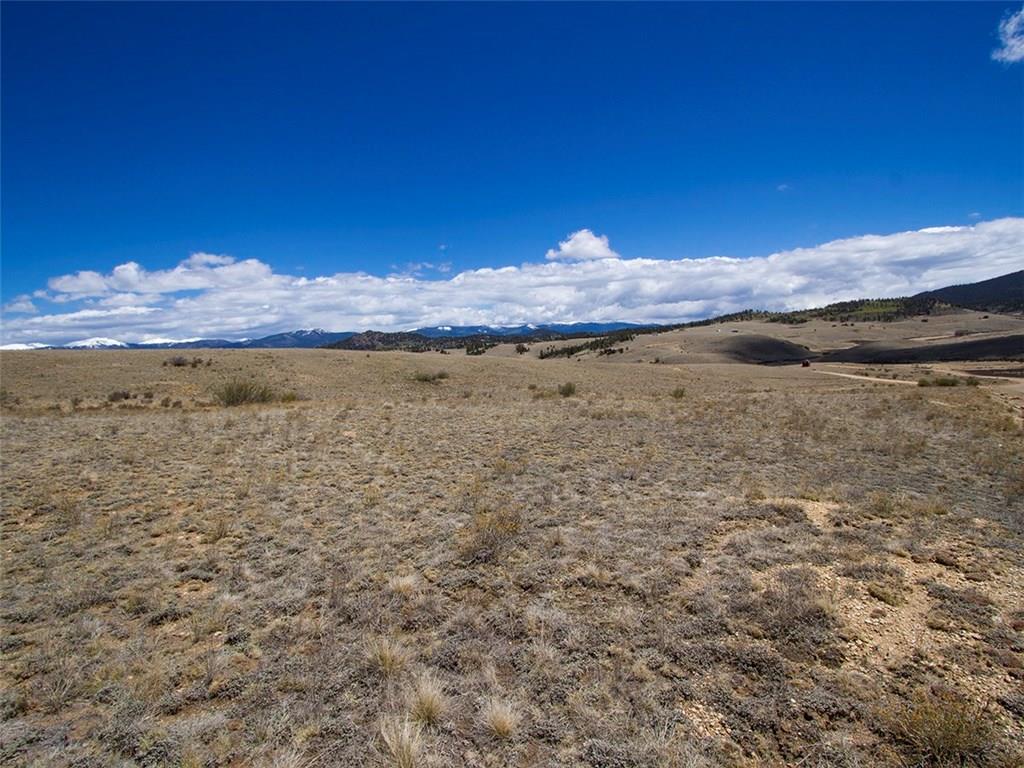 329 Albino Road Como, CO 80456 - Photo 1 of 20 a view of a lake with a mountain in the background