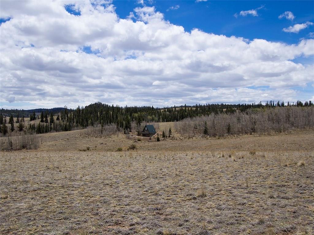 329 Albino Road Como, CO 80456 - Photo 6 of 20 a view of a dry yard with wooden fence