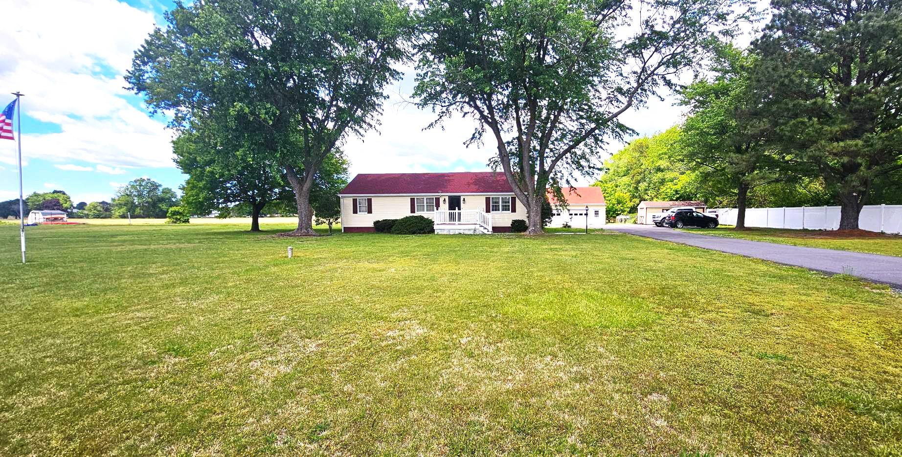 333 McGrath Road Eden, MD 21822 - Photo 2 of 22 a view of a house with a big yard and large trees