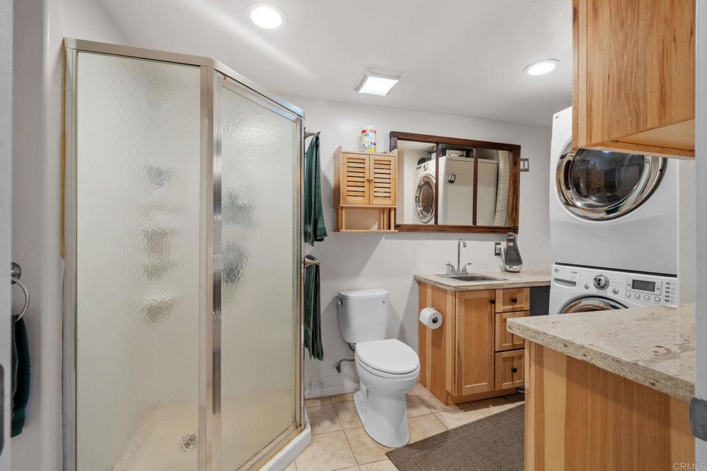 22002 Lyons Valley Road Alpine, CA 91901 - Photo 37 of 75 a bathroom with a toilet a sink and a shower