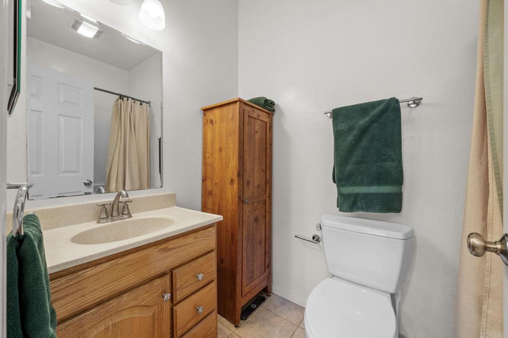 22002 Lyons Valley Road Alpine, CA 91901 - Photo 45 of 75 a bathroom with a sink a toilet and shower