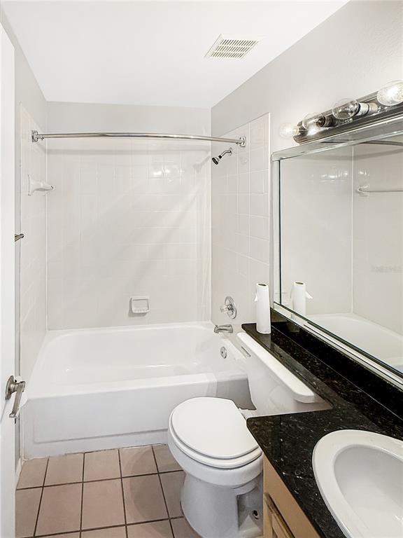 90 Hidden Lake Drive, Unit 132 Sanford, FL 32773 - Photo 8 of 13 a bathroom with a sink a toilet and a bathtub